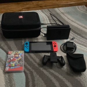 Nintendo Switch With Super Mario Odyssey And a Nintendo Switch Case